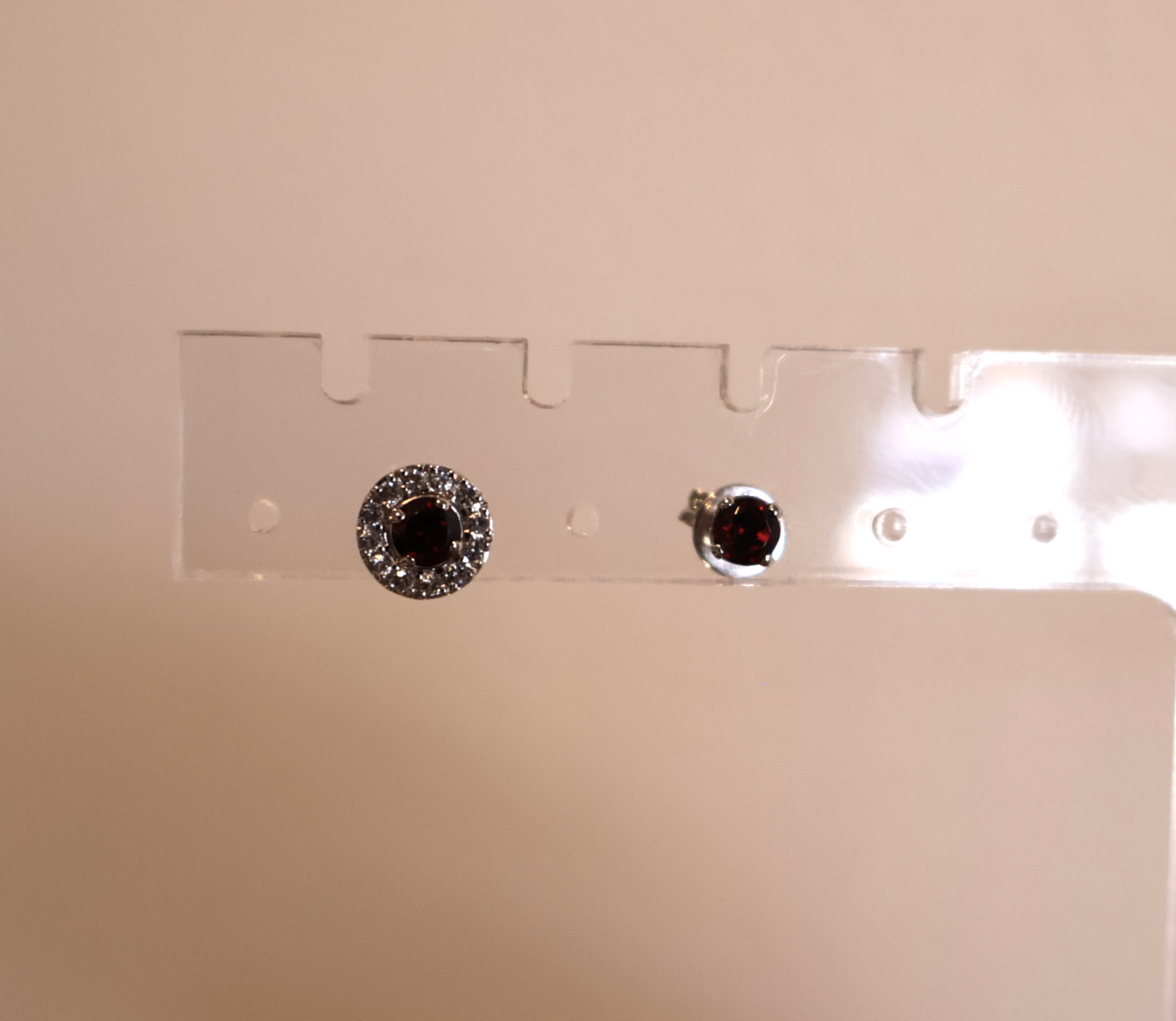 Pair of earrings on a beige background