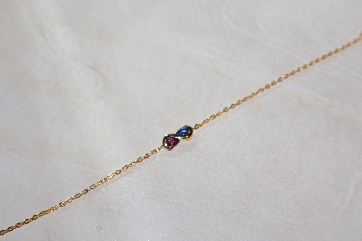 AUR Infinity Bracelet – Sapphire & Ruby Duo